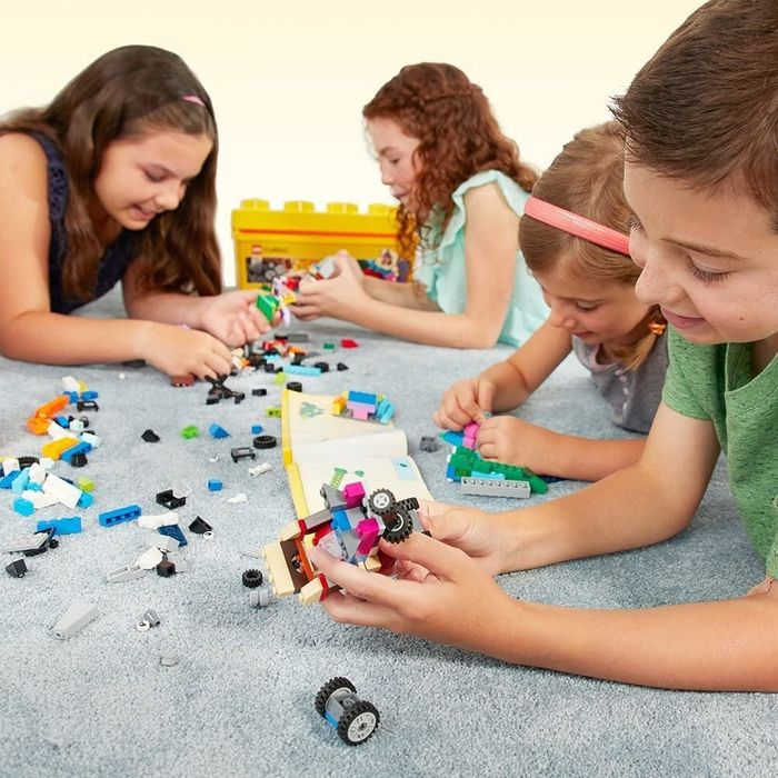 Children playing with a Lego set