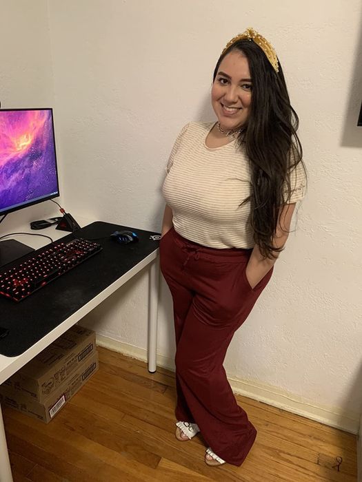 a reviewer wearing the pants in red