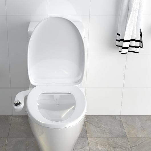 a toilet equipped with the Bio Bidet attachment