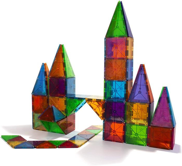 Brightly colored magnetic tiles for children assembled into a castle
