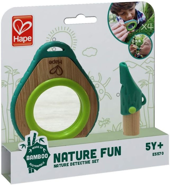 A nature discovery kit with a child’s magnifying glass and a whistle for exploration.
