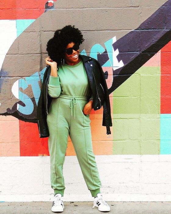 The reviewer is seen rocking the long-sleeved set in a fresh green color.