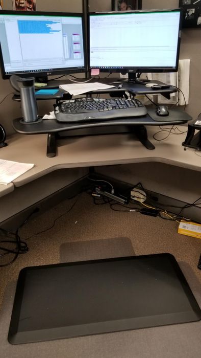 Another reviewer’s mat positioned in front of their desk.