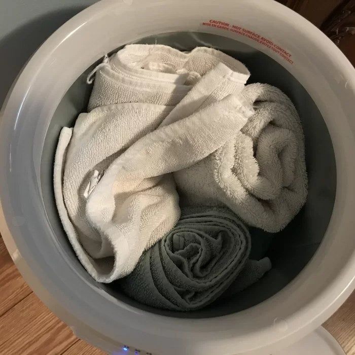 Reviewer's photo showing towels inside the towel warmer