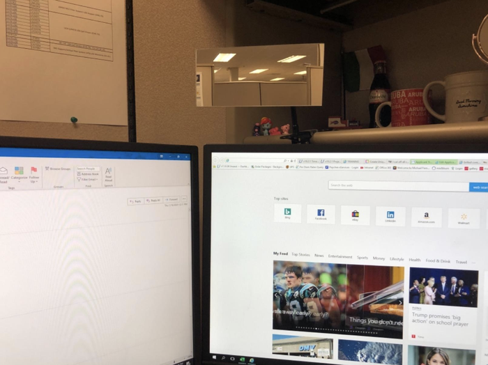 A reviewer's mirror attached to the side of a monitor