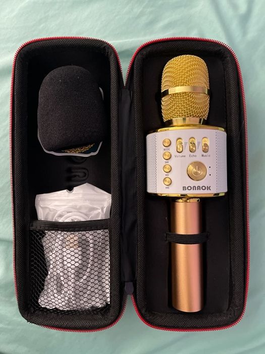 A sleek gold microphone, adding a touch of elegance to any karaoke session.