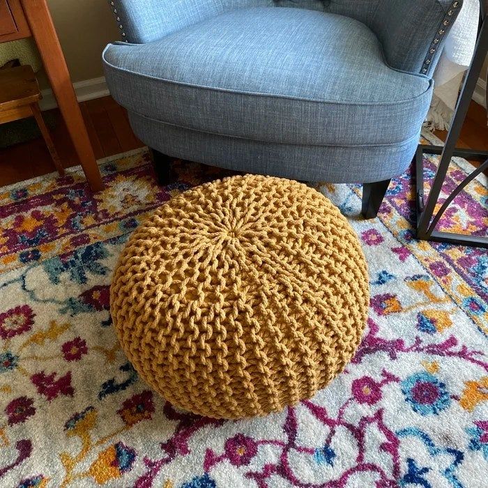 A reviewer’s photo of the ottoman in Yellow Cotton.