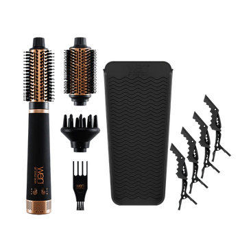 Hair styling tools such as a volumizing brush, detachable heads, and hair clips set against a simple background