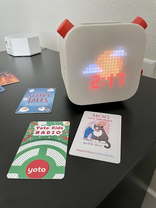 A reviewer’s Yoto device surrounded by various Yoto cards.