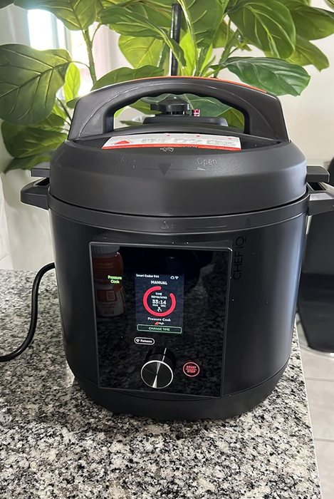 A photo of the cooker sitting on a countertop.