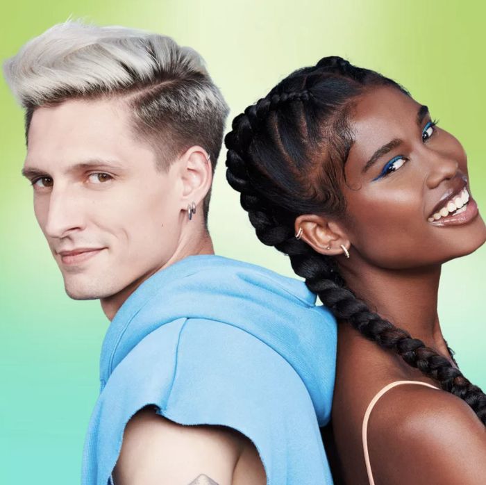 Two individuals with different hairstyles, each using the finishing paste in their hair