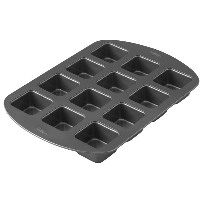 A gray pan with brownie marks on it.