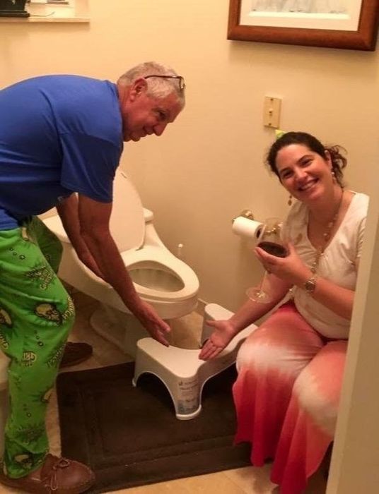Happy reviewers posing with their Squatty Potty