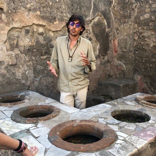 A guide shares insights while leading a history tour.