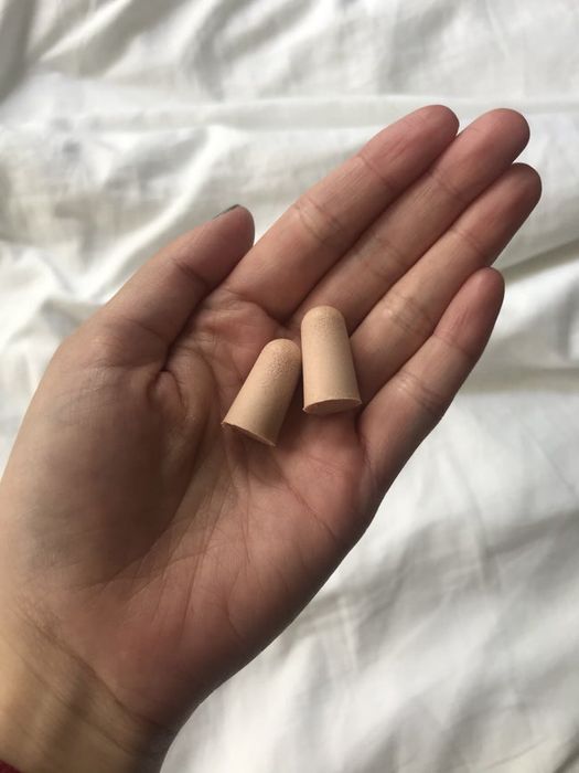 Mytour Editor holding the ear plugs