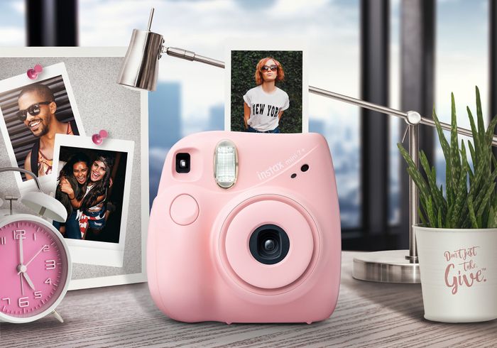 Pink Fujifilm Instax instant camera.
