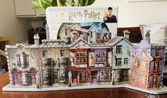 A reviewer's completed puzzle featuring six colorful buildings