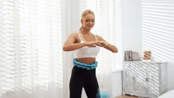A model swings a blue weighted fitness hoop, adding a fun and effective twist to their workout.