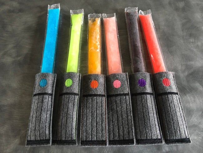 Long ice pops with felt holders that make them resemble light sabers