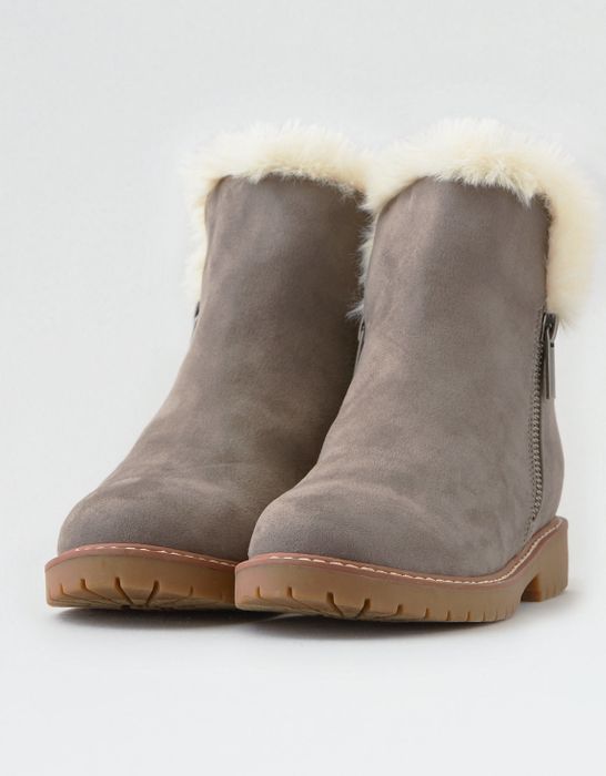 brown faux suede boot with side zippers and a cozy white shearling lining