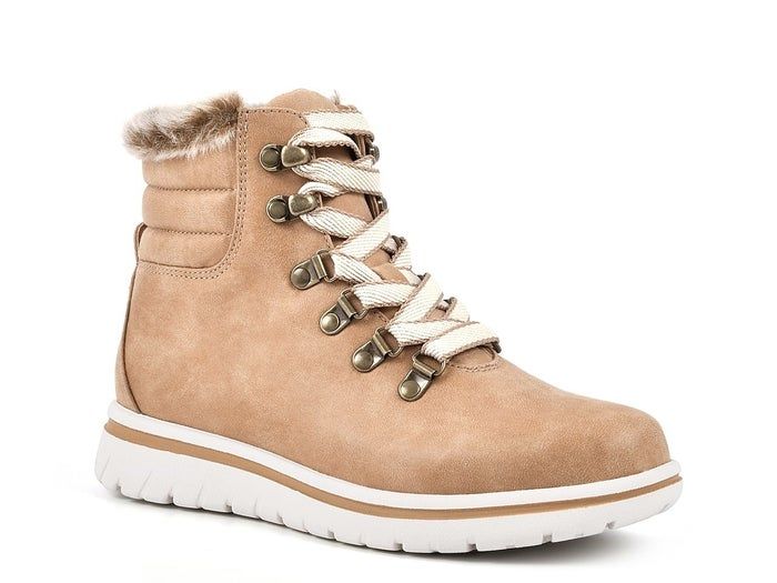 Lace-up boots featuring a tan color with a white tennis-shoe style sole and faux fur around the ankle for extra warmth