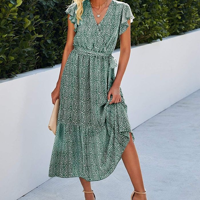 A model is showcasing the stunning green dress.