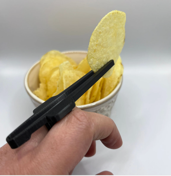 The model holding the chip between the device