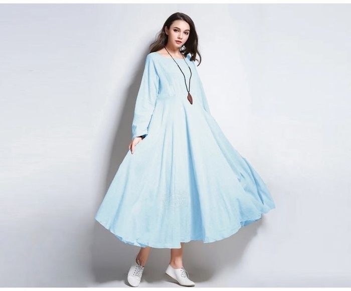 Model showcasing a light blue dress.