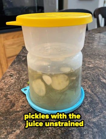 pickles and juice inside a container