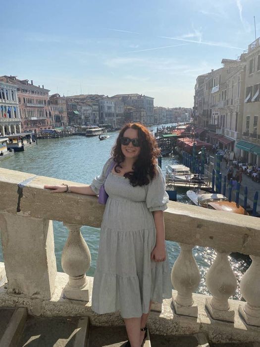 A Mytour editor wearing a pale green nap dress while in Italy.