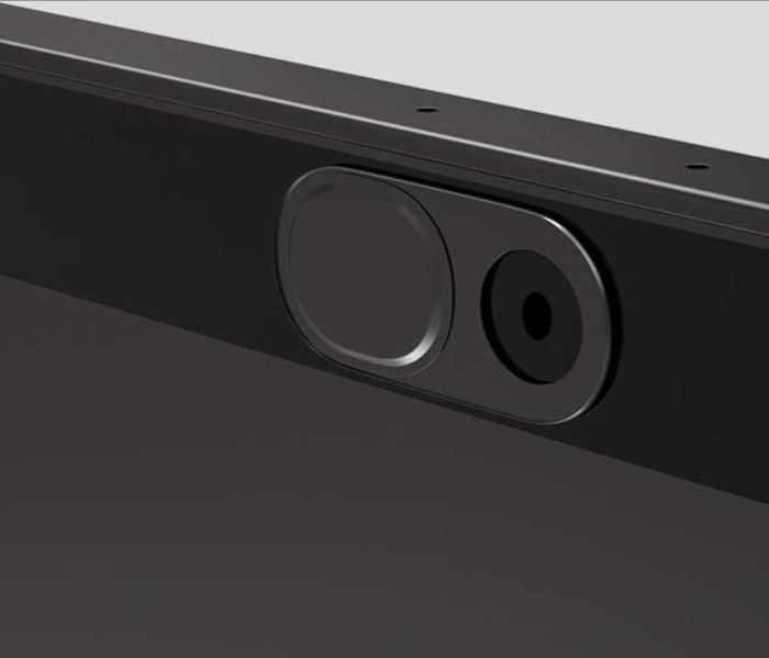 A small black cover that fits around a computer camera with a sliding tool that can open or close the camera lens.