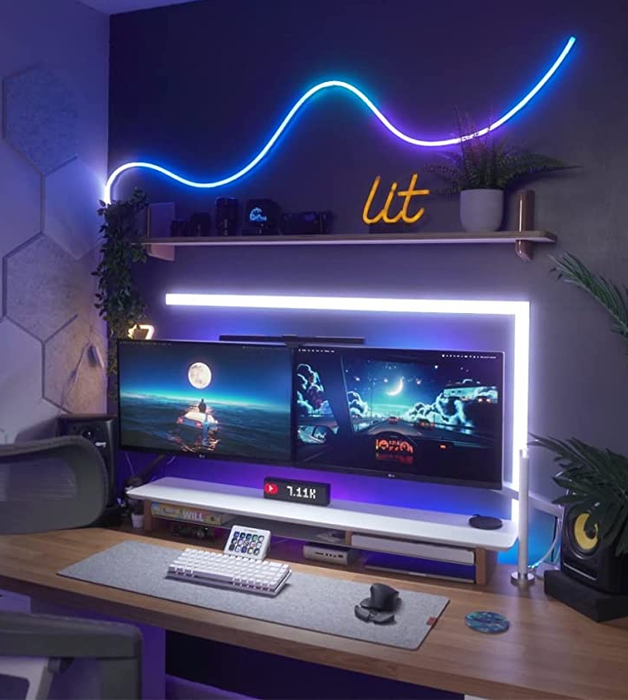 Another reviewer's workspace, with the neon rope light creatively arranged in a flowing wave pattern above the desk, adding a dynamic touch to the decor.