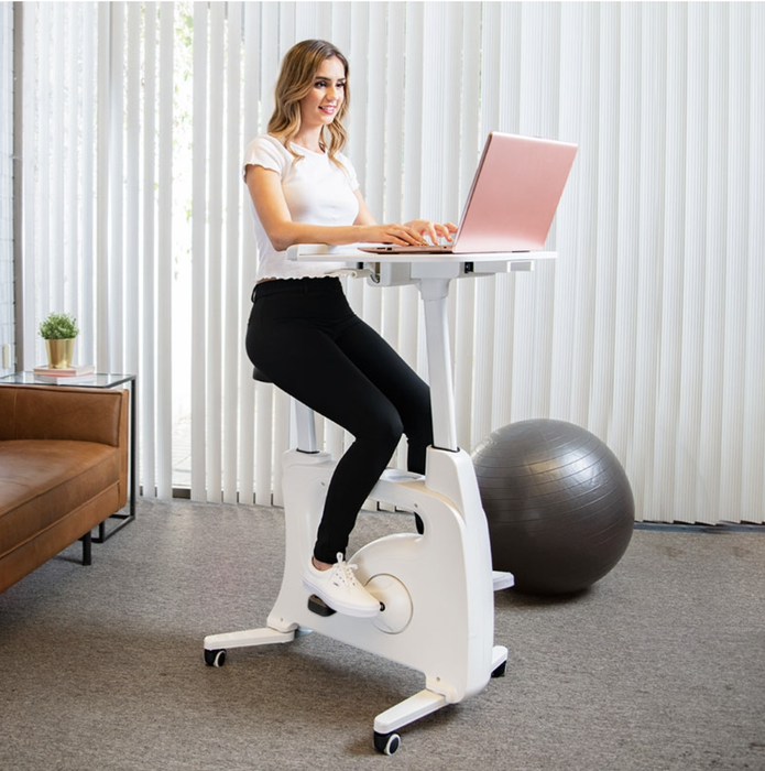 A person using a white rolling desk bike, complete with space for a laptop.