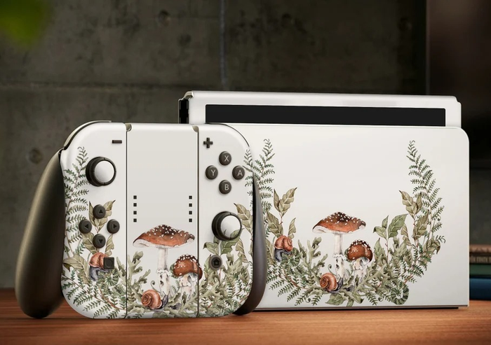 A Nintendo Switch set adorned with white, green, and brown mushroom-themed skins.