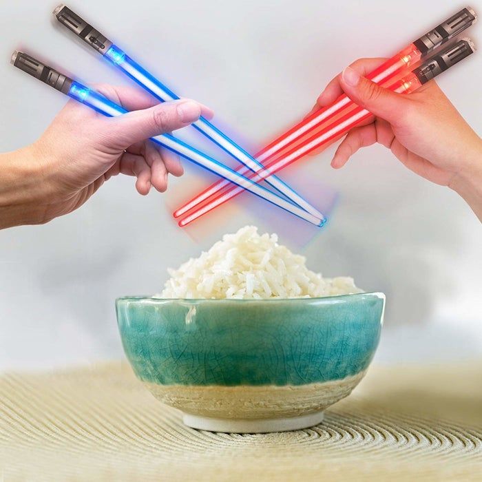 The glowing chopsticks in vibrant red and blue hues