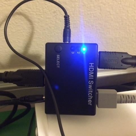 The blue light from the charger, softened by a sticker.