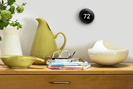 The Nest thermostat installed on the wall.