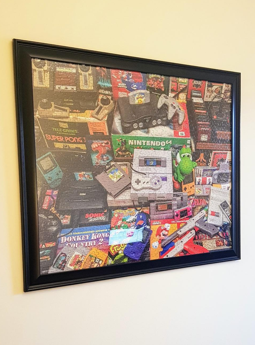 The puzzle mounted in a frame on the wall