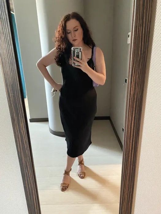 The writer dons the same dress, highlighting its elegant look.