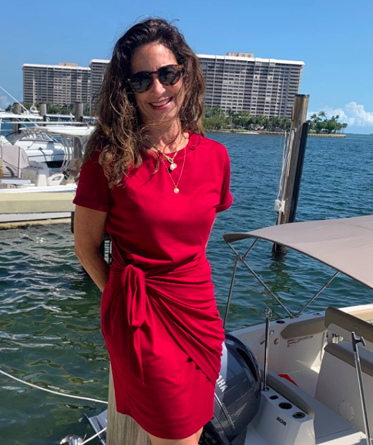 A customer photo review of them wearing the dress in red