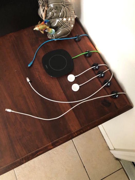 A table showcasing several cables neatly organized with the help of cable clips, making the setup tidy and efficient.