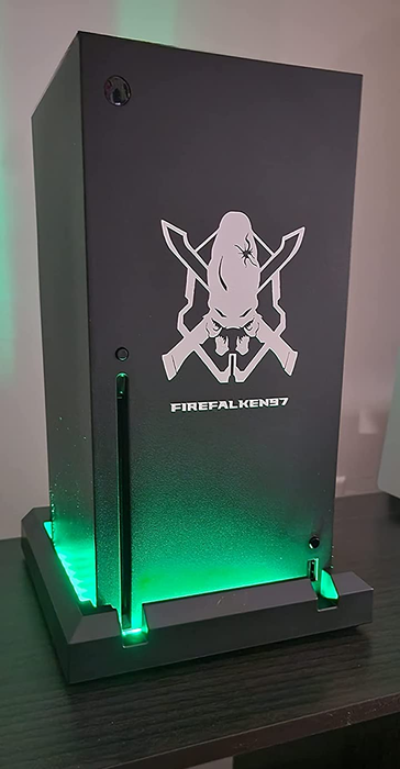 An Xbox Series X lit up in a lively green hue, adding an energetic touch to your gaming space.