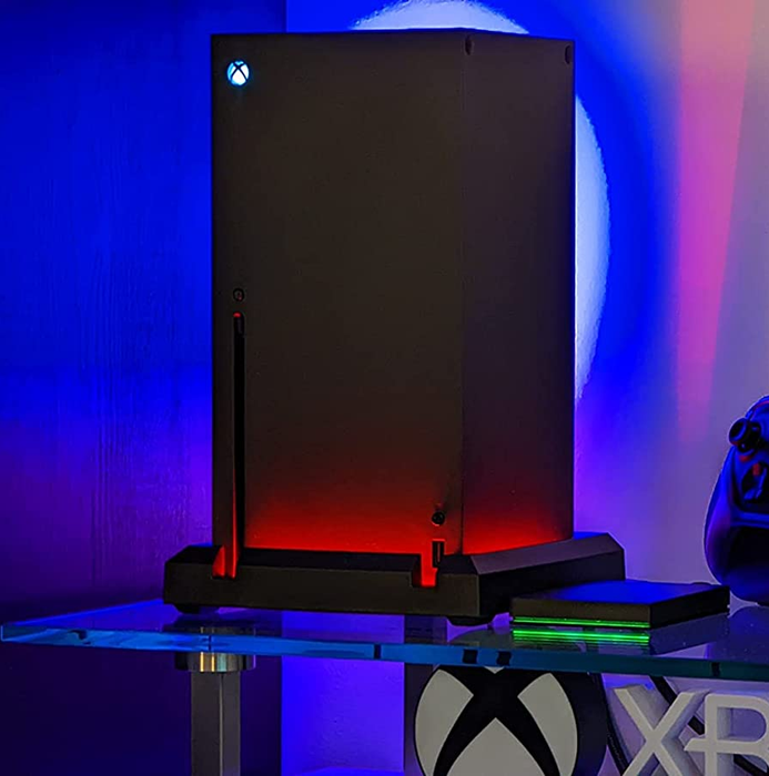 An Xbox Series X glowing with vibrant red lighting, creating a bold and striking visual effect.