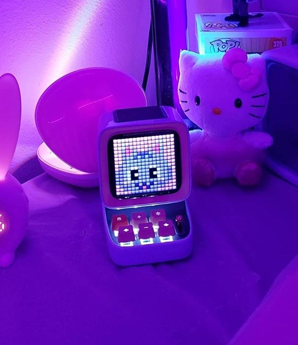 The Divoom Bluetooth speaker glowing at night