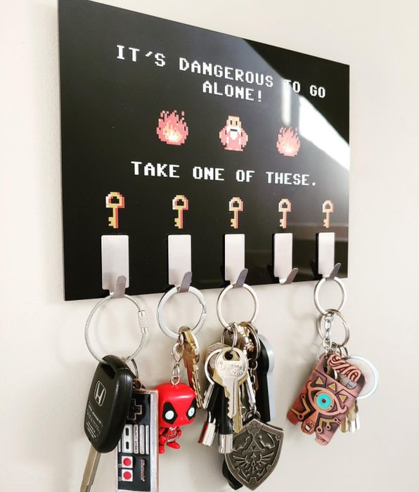 A reviewer photo showcasing the black plaque and keys hanging from the attached hooks