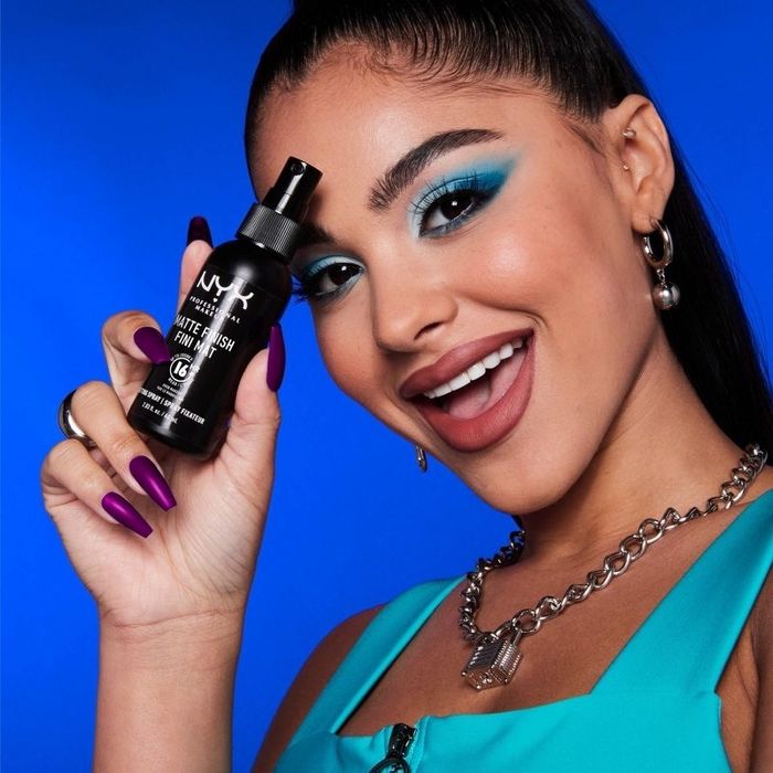 Model showcasing the setting spray