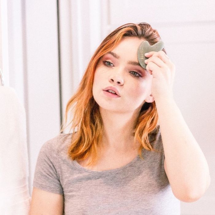 Model using the gua sha