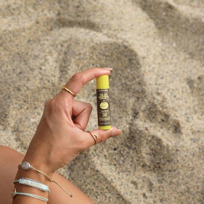 Model holding the lip balm