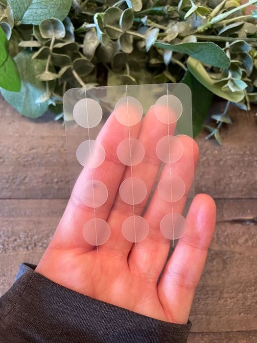 A reviewer holding the slim pimple patch in their hand.
