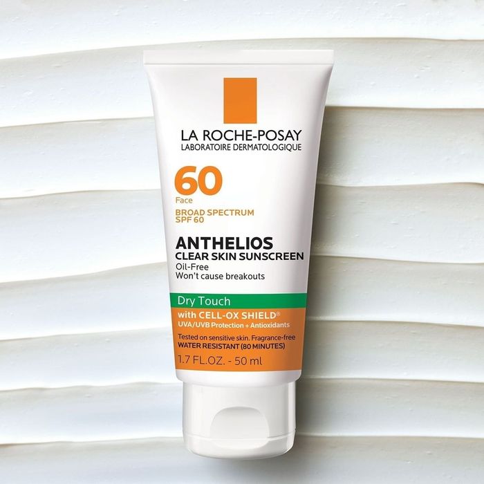 The sunscreen bottle reads 